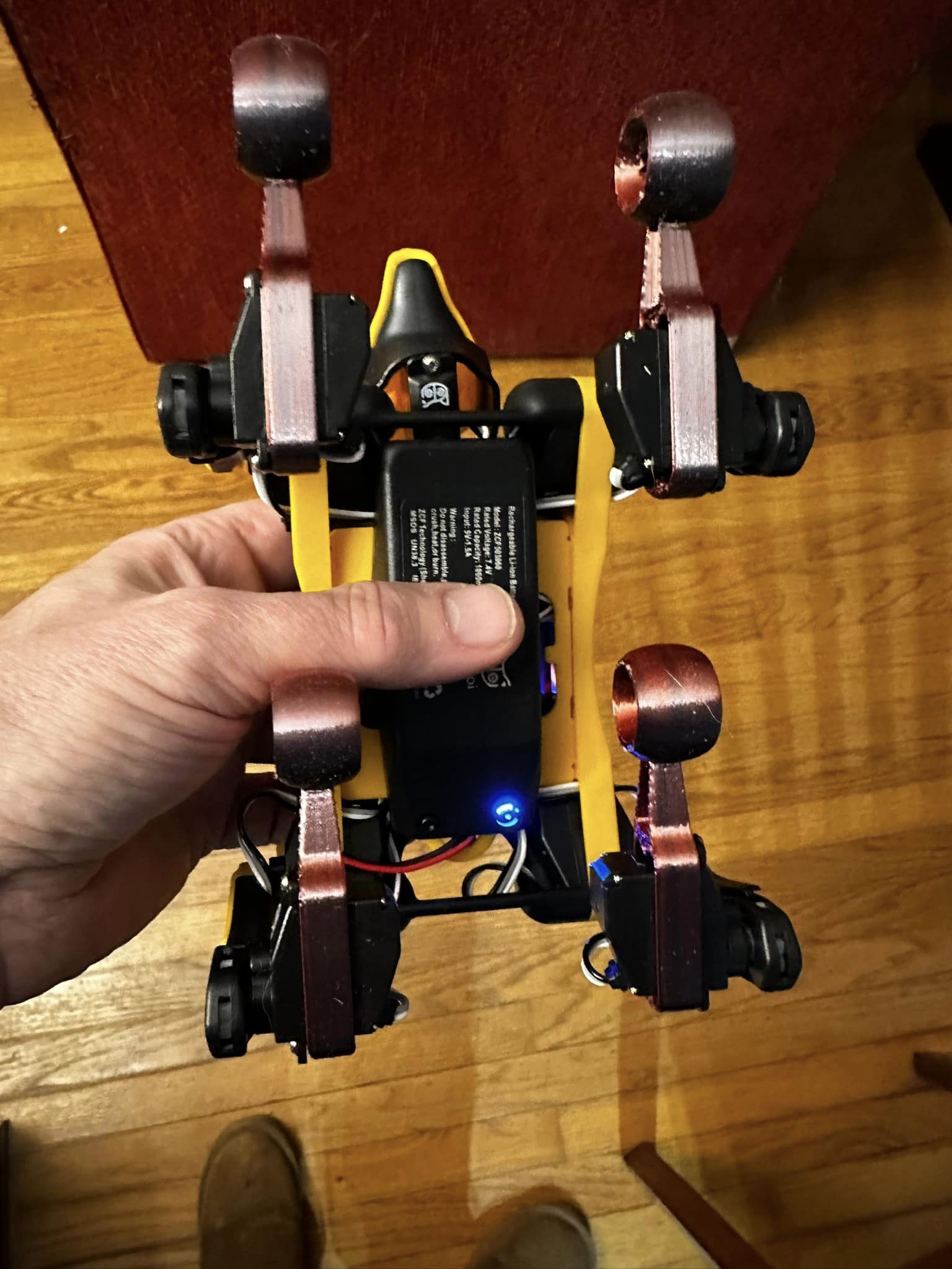 Picture of the underside of the robot dogs, with the new feet.